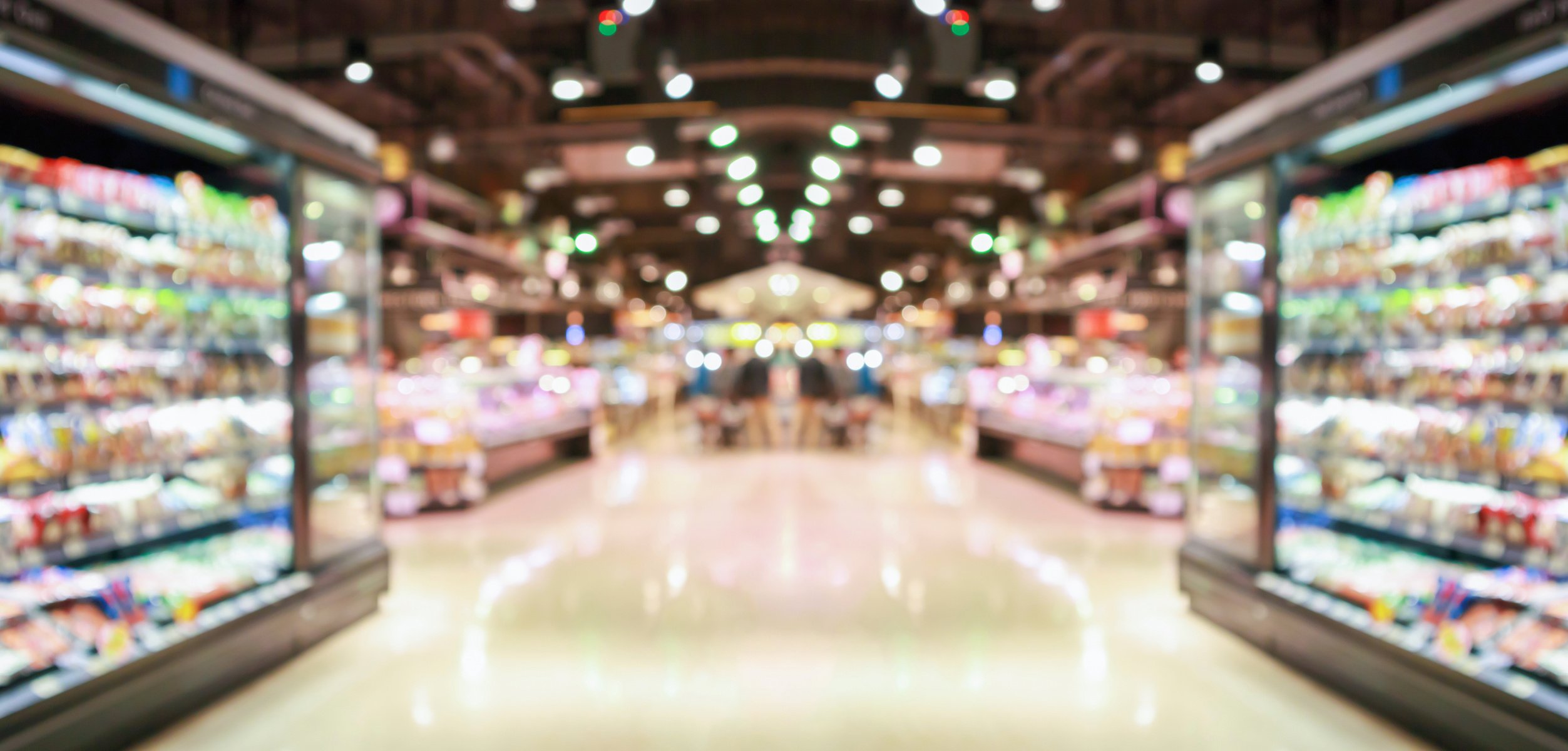 supermarket grocery store aisle and shelves blurred background